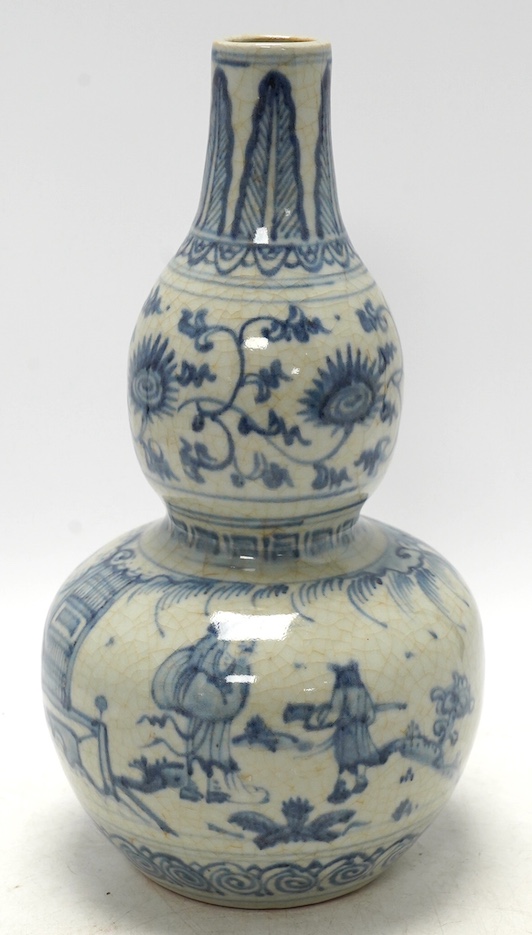 A Chinese blue and white double gourd vase, 28cm high. Condition - fair, chipping to base